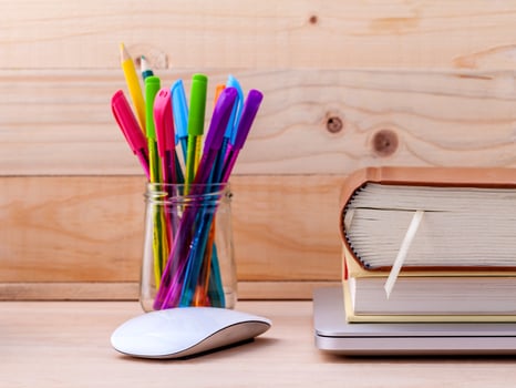 Utensils with a mouse and books photo