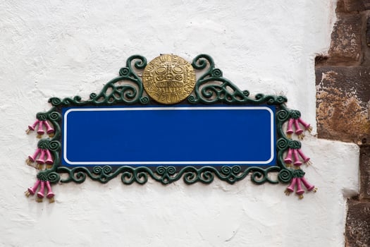 Blank empty blue street sign on a plastered wall photo
