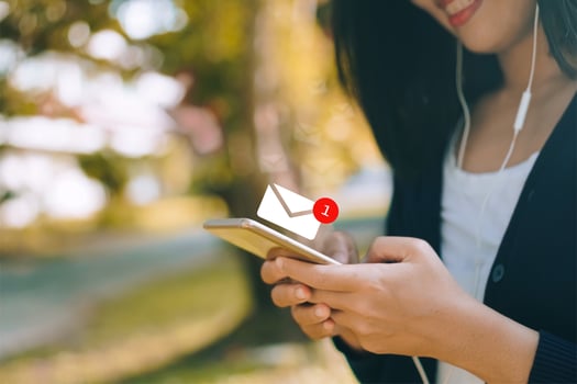 Woman hand using smartphone to send and recieve email. photo