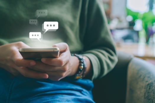 Woman using a smartphone with technology icons in the background photo