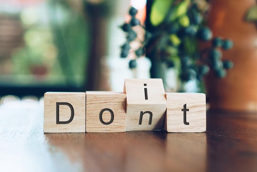 Do it or don't on wooden cubes on table photo