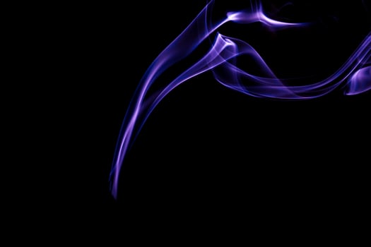 Colored smoke on a black background photo