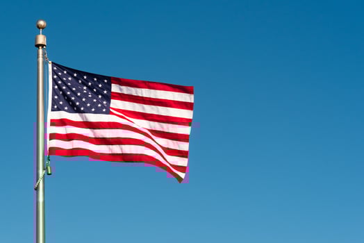 American flag blowing in the wind photo