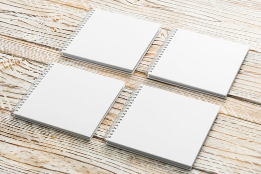 Blank notebooks on wooden background photo