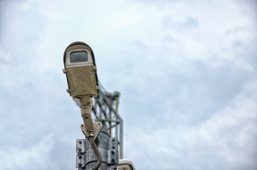 Surveillance camera against the sky photo