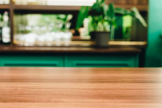Selective focus of wooden table with blur coffee and restaurant cafe photo