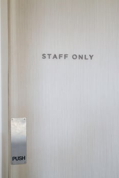 Staff only sign on a wooden door photo