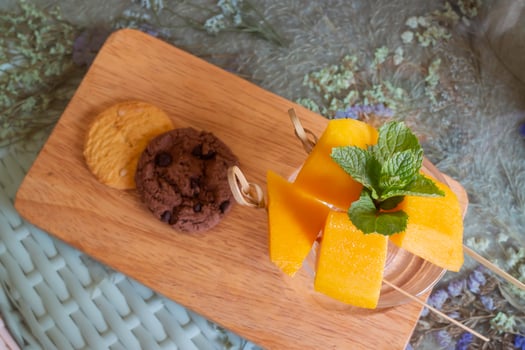 Yellow mango fruit and cookies photo