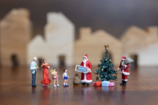 Miniature Santa Claus and a happy family, Merry Christmas and Happy New Year concept photo