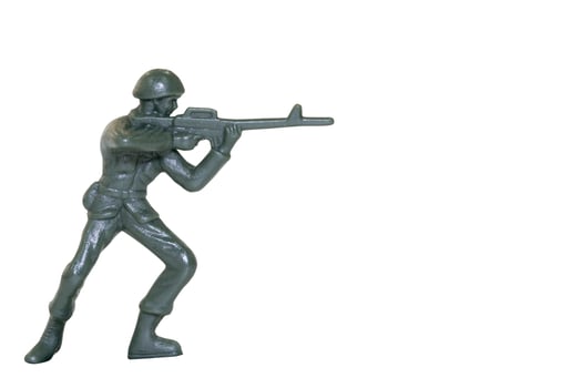 Miniature toy soldier on a white background photo
