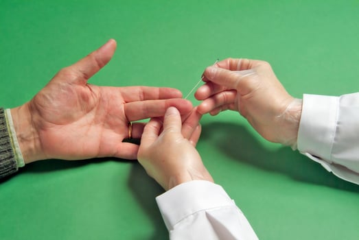 Blood test on the finger photo
