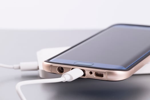 Phone charging on a power bank photo