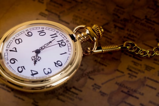 Gold pocket watch on ra map photo