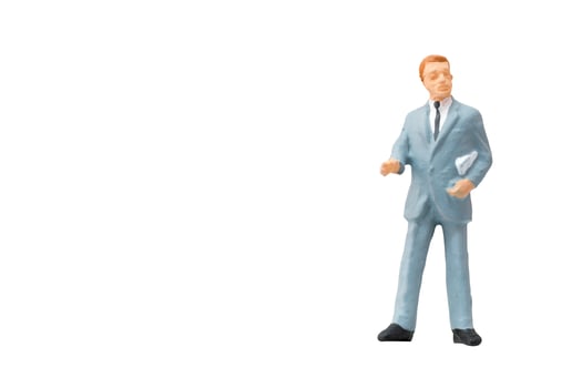 Miniature businessman on a white background photo