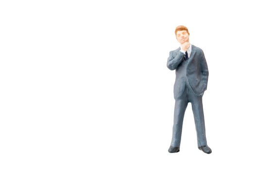 Miniature businessman on a white background photo