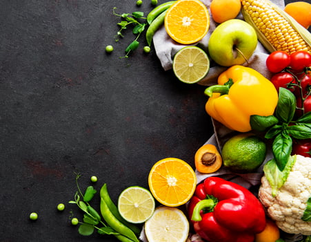 Vegetables and fruits on a black concrete background photo