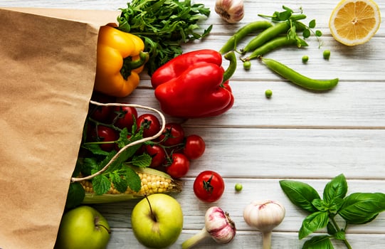 Paper bag with fruits and vegetables, eco friendly, flat lay photo