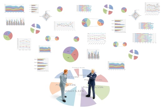 Miniature businessmen standing with charts on a white background photo