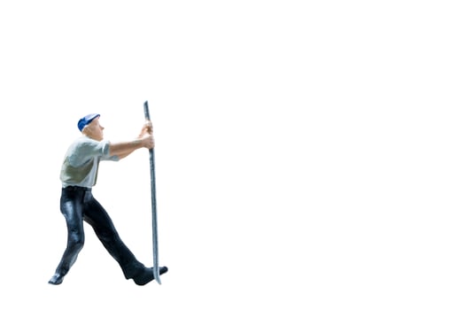 Miniature construction worker on isolated on a white background photo