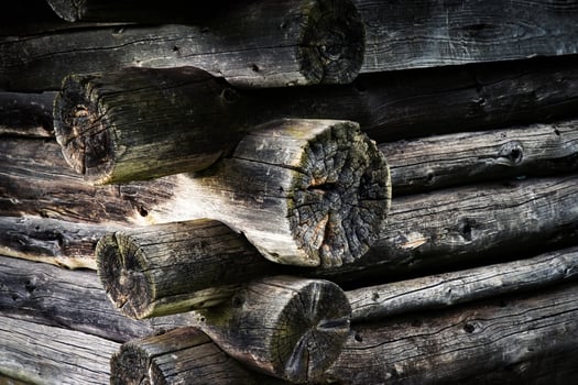 Corner of an old wooden cabin photo