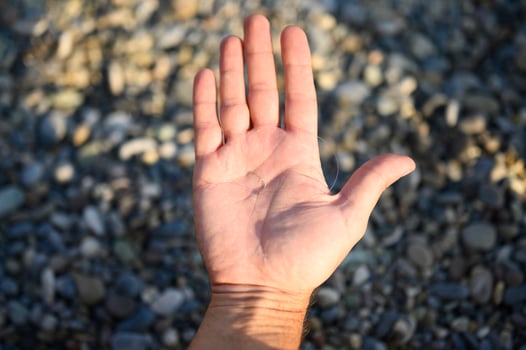 Man's hands tying a fishing line on a fishing hook photo