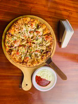 Delicious pizza with vegetables on the table photo
