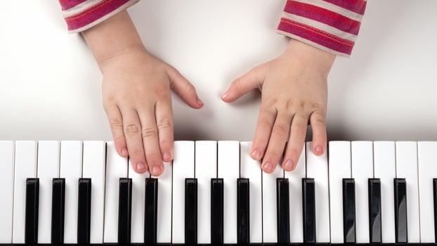 Kid's hands on a keyboard photo