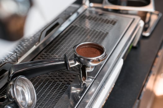 Coffee tamper on a coffee machine photo