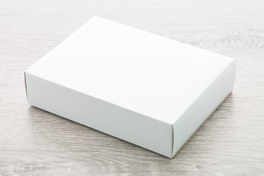 Paper box on wood background photo