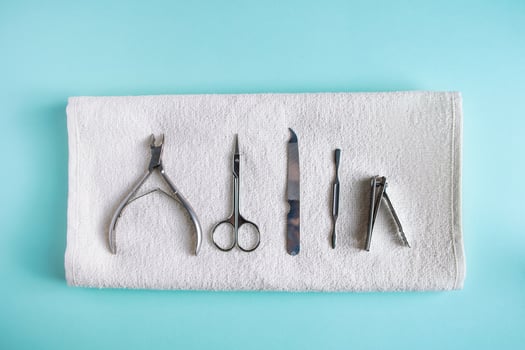 Tools for manicure and nail care on blue background photo