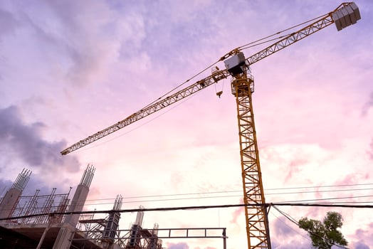 Yellow construction tower crane photo