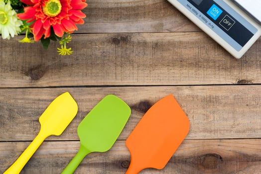 Silicone bakery and cooking tools on a wooden table photo