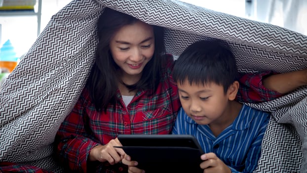 Mother and son watching a movie together photo
