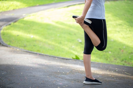 Woman stretching outside photo
