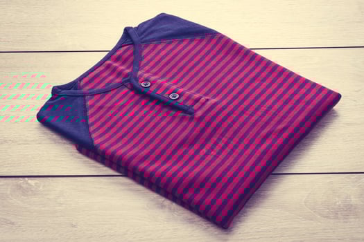 Shirt on wooden background photo
