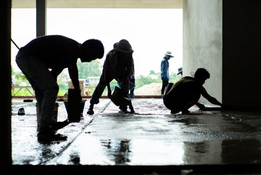 Silhouette group of workers in the house under construction photo