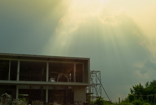 Landscape of construction site with the pile of building material and blue sky with sunshine. photo