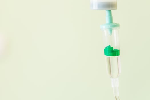 Selective focus point saline IV drip for patient photo