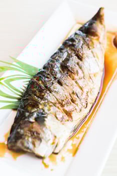 Grilled Saba fish with black sweet sauce photo