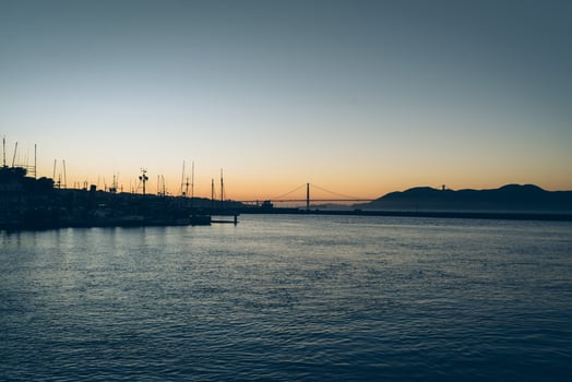 City silhouette at sunset on the water photo