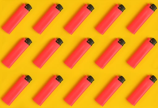 Repeating ligthers in rows. Creative concept texture pattern image. photo