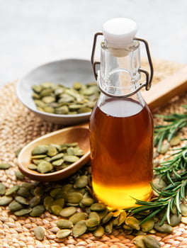 Bottle with pumpkin seed oil photo