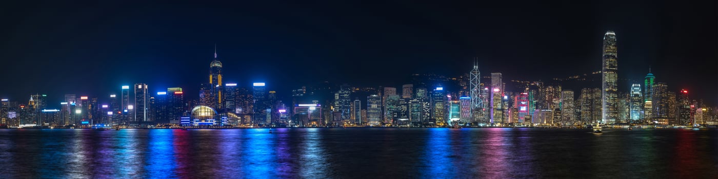 Colorful panoramic view of Hong Kong skyline at night photo