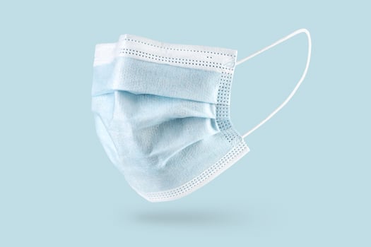 Blue face mask on a blue background photo