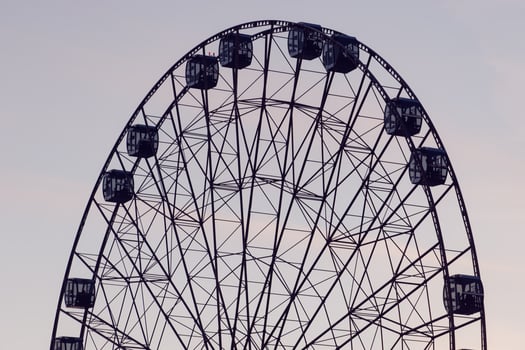 Ferris wheel with a cloudy sky photo