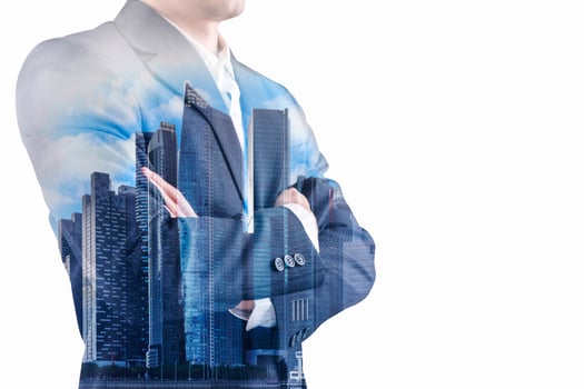 Double exposure of a businessman wearing a suit and a modern city building of Asian business financial district and commerce in Bangkok, Thailand photo