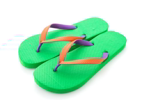 Green flip flop isolated on white background photo