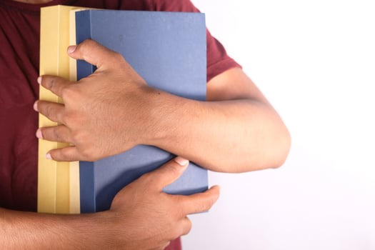 Man holding books photo