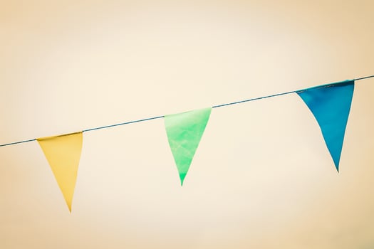 Color flags on the sky - vintage filter effect photo