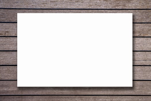 Blank paper texture on vintage brown wood background photo